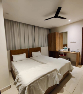Triple Sharing Room interior at Hotel Hibiscus Tree